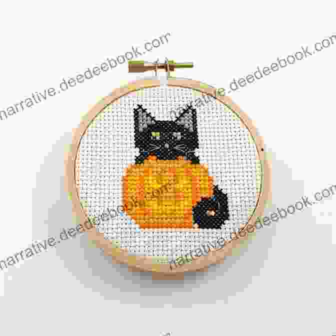 A Close Up Of A Completed Halloween Cross Stitch Featuring Cute Pumpkin And Ghost Motifs Cross Stitch For Halloween: 13 Spooky Designs: 13 Cross Stitch Designs Featuring A Variety Of Different Halloween Images (Caz Hoyle S Cross Stitch Designs)