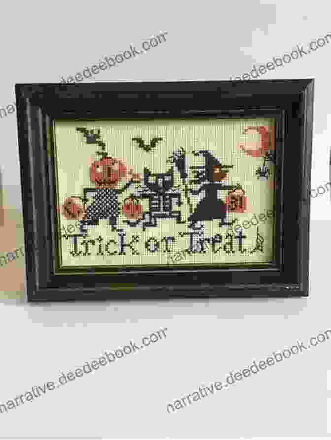 A Close Up Of A Completed Halloween Cross Stitch Wall Hanging Featuring A Haunted House Design Cross Stitch For Halloween: 13 Spooky Designs: 13 Cross Stitch Designs Featuring A Variety Of Different Halloween Images (Caz Hoyle S Cross Stitch Designs)